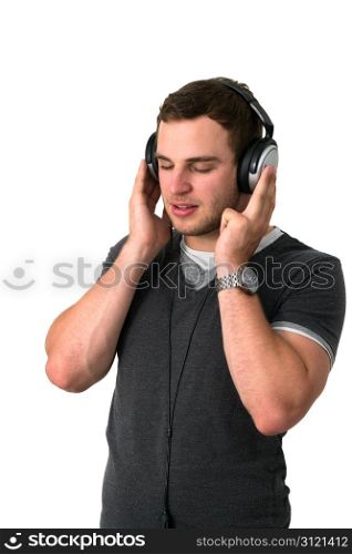 Young man in grey t-shirt listening to music with earphones