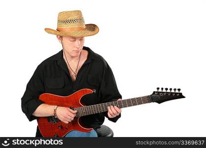 Young man in hat play on guitar