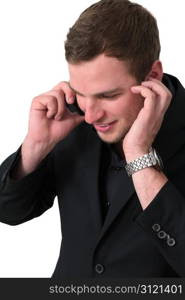 Young Man in jacket talking on the phone and smiling