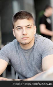 Young man in outdoor restaurant