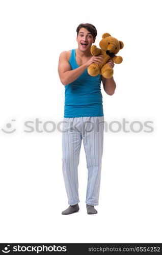 Young man in pajamas with toy animal isolated on white backgroun. Young man in pajamas with toy animal isolated on white background