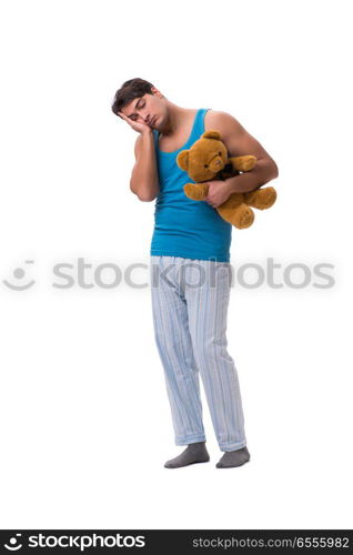 Young man in pajamas with toy animal isolated on white backgroun. Young man in pajamas with toy animal isolated on white background
