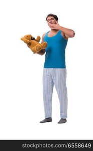 Young man in pajamas with toy animal isolated on white backgroun. Young man in pajamas with toy animal isolated on white background