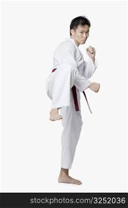 Young man in side kick position