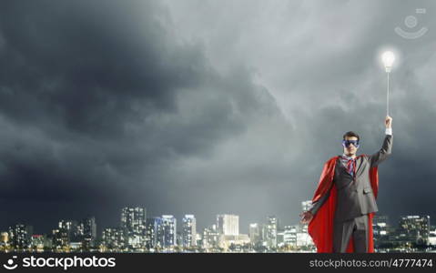 Young man in superhero costume representing creativity concept. Creativity is what I am god at