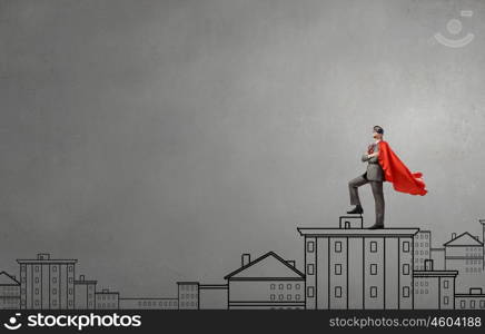 Young man in superhero costume representing power and courage