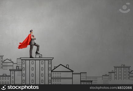 Young man in superhero costume representing power and courage