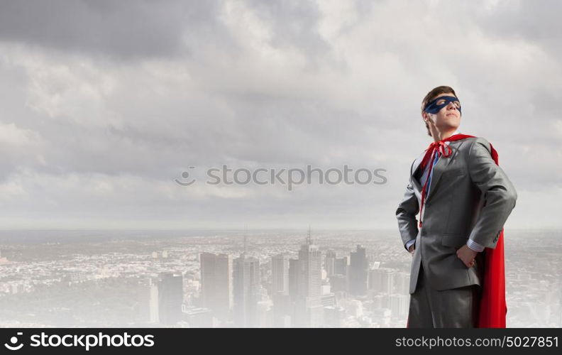 Young man in superhero costume representing power and courage