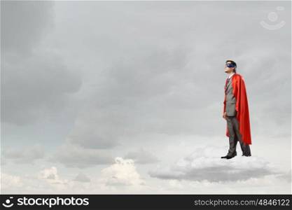 Young man in superhero costume representing power and courage. I&rsquo;m super man