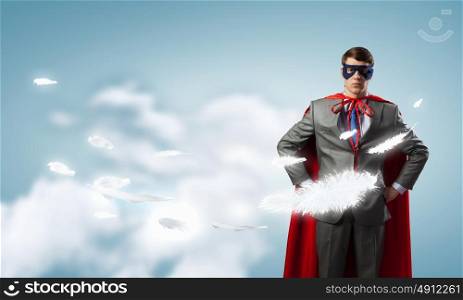 Young man in superhero costume representing power and courage. I&rsquo;m super man