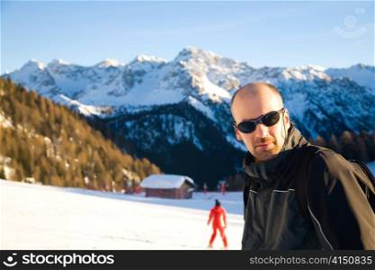 Young Man In The Alps Mountains. Winter Sport Series.