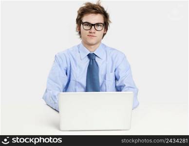 Young man in the office working in the laptop