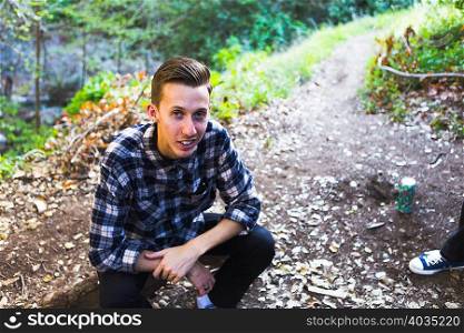 Young man in woods, Upland, California, USA