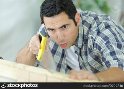 young man in woodworking hobby concept