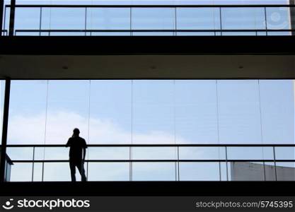 young man inside a modern office building