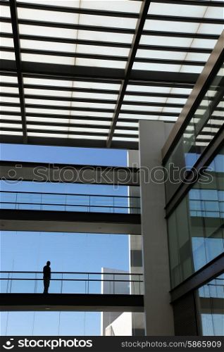 young man inside a modern office building