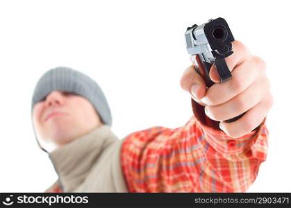 Young man is aiming with gun. Isolated on white.