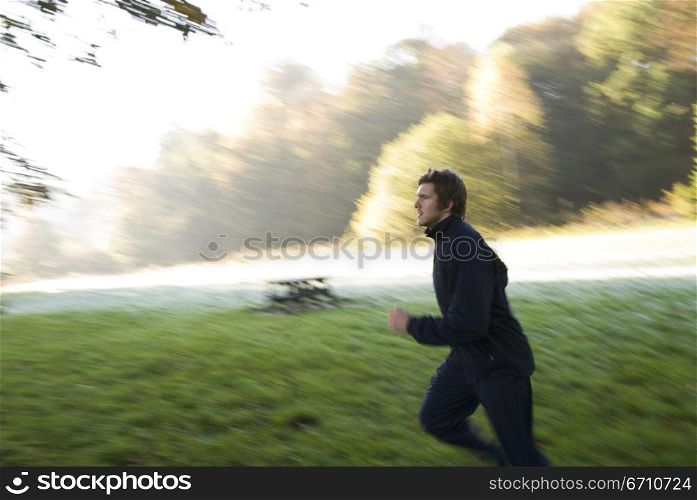 Young man jogging in a park