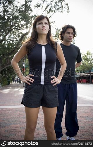 Young man jogging with physical trainer