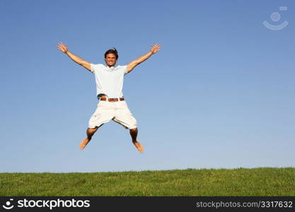 Young man jumping in air