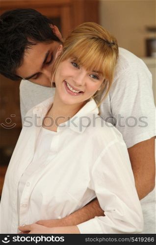 Young man kissing his partner
