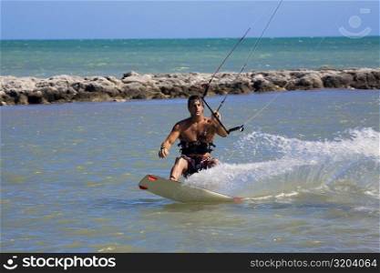 Young man kite boarding in the sea, Smathers Beach, Key West, Florida, USA