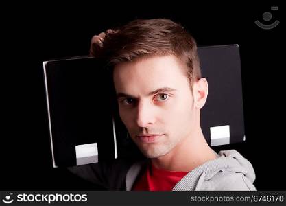 Young man listening to music - isolated