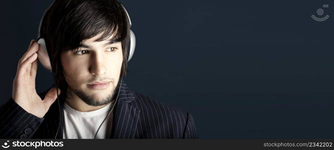 Young Man listening to music with headphones