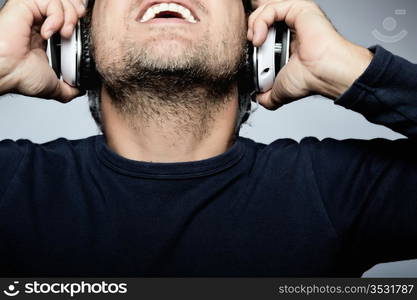 Young man listening to music with white headphones