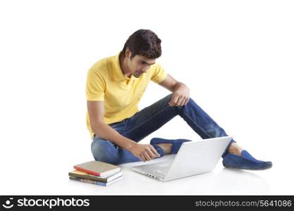 Young man looking at a laptop