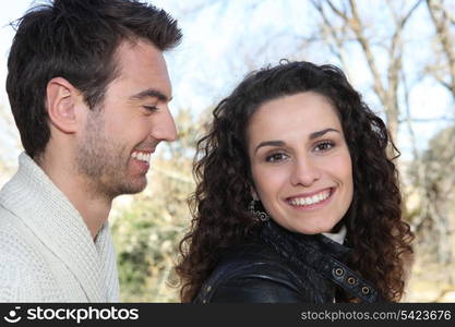 young man looking at girlfriend