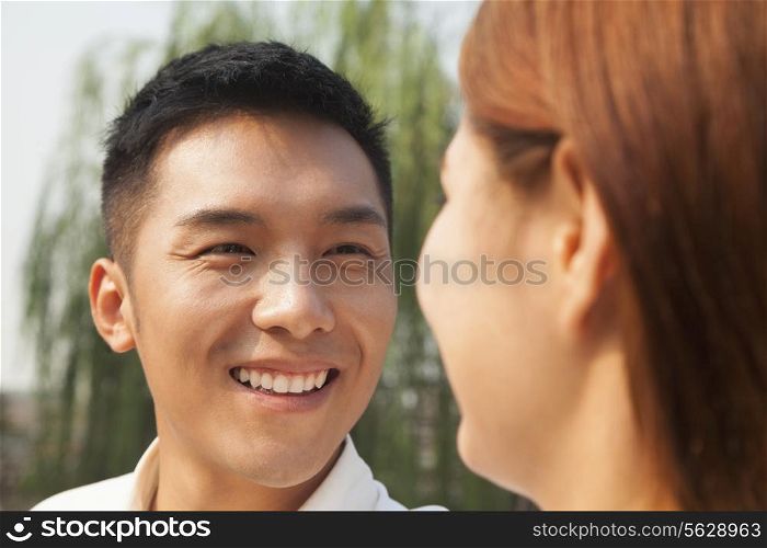 Young Man Looking at His Girlfriend
