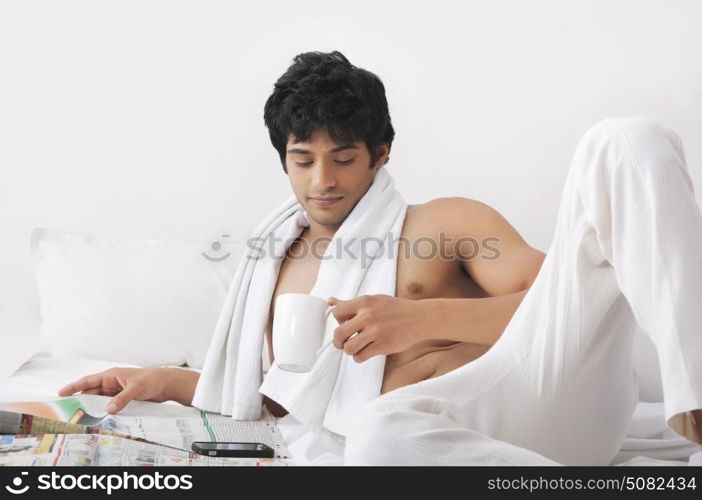 Young man looking at mug