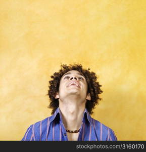 Young man looking up