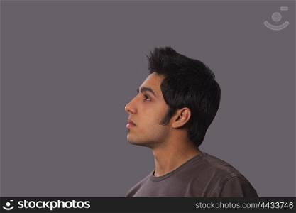 Young man looking up