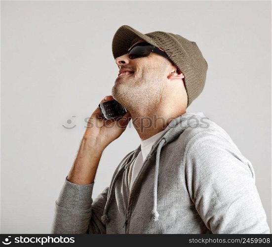 Young man making a phone call with a cellphone