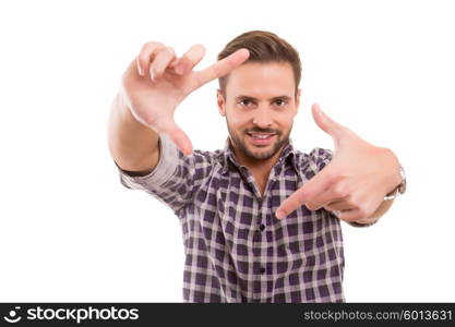 Young man making framing key gesture - isolated over white