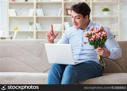 Young man making marriage proposal over internet laptop