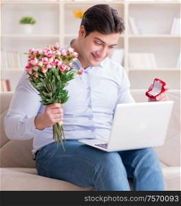 Young man making marriage proposal over internet laptop. The young man making marriage proposal over internet laptop
