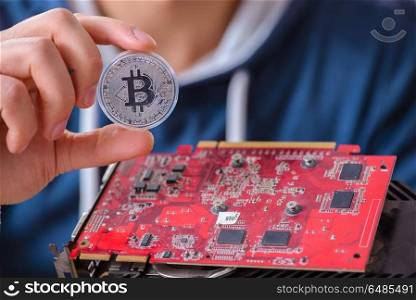 Young man mining bitcoins at home
