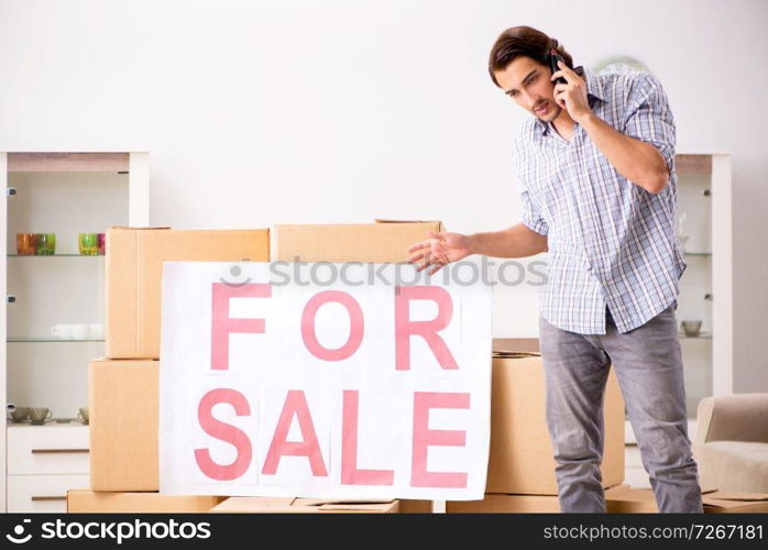 Young man offering home for sale and moving out 