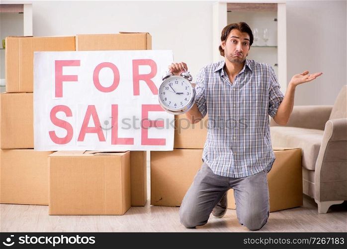 Young man offering home for sale and moving out 