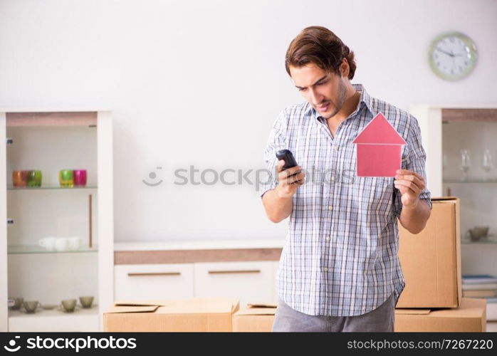 Young man offering home for sale and moving out 