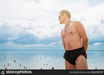 Young man on a beach. Young man on a summer beach in sunny day