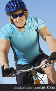 Young man on bicycle outdoors