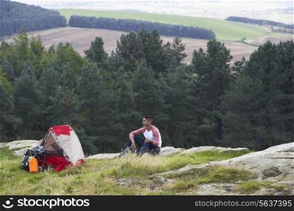 Young Man On Camping Trip In Countryside