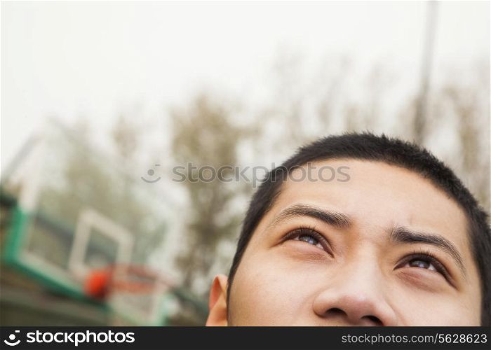 Young man on the basketball court, portrait