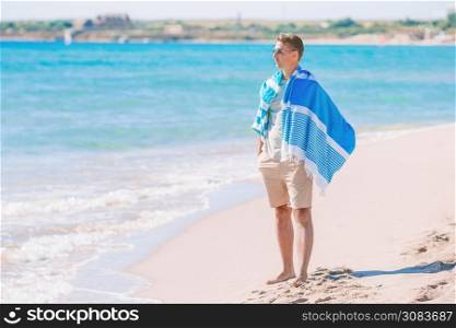 Young man on the beach relaxing. Young man on the white beach on vacation