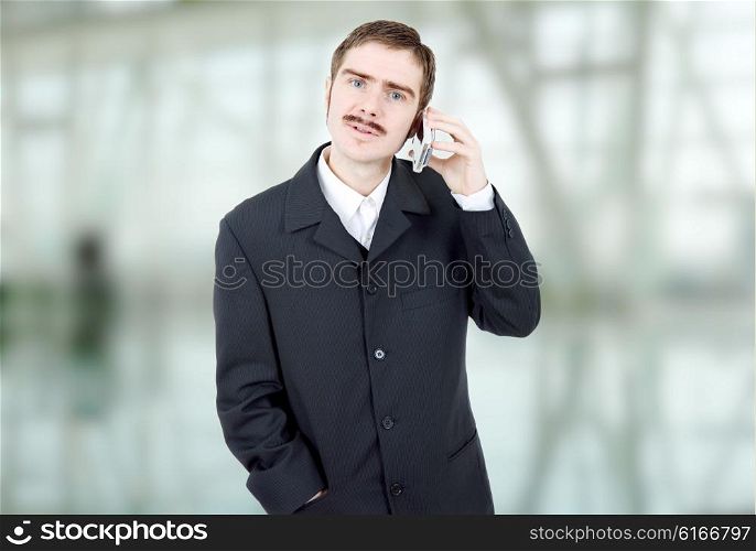 young man on the phone at the office