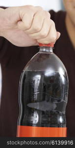 Young Man Opening Bottle Of Soda